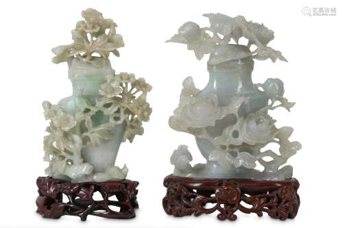 TWO CHINESE APPLE-GREEN JADEITE 'BIRDS AND FLOWERS' VASES AND COVERS.
