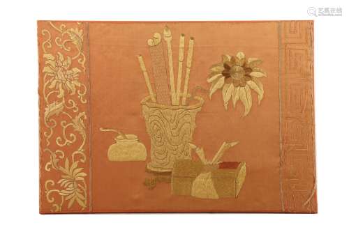 A CHINESE PEACH-GROUND EMBROIDERED 'SCHOLAR'S DESK' SILK PANEL.