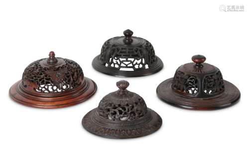 FOUR CHINESE WOOD JAR COVERS.