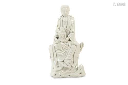 A CHINESE BLANC-DE-CHINE FIGURE OF GUANYIN AND CHILD.