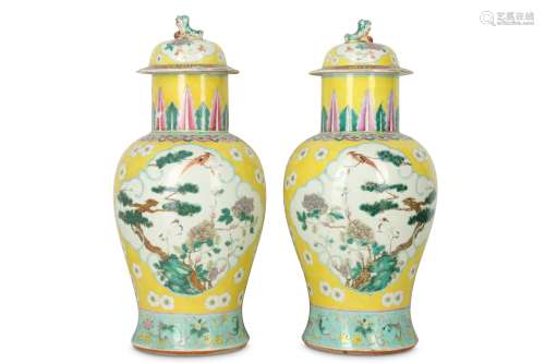A PAIR OF CHINESE FAMILLE ROSE YELLOW-GROUND BALUSTER VASES AND COVERS.