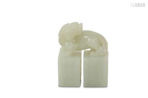 A CHINESE WHITE JADE DOUBLE 'QILIN' SEAL.