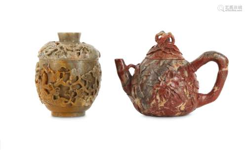 A CHINESE SOAPSTONE 'MAGNOLIA' TEAPOT AND COVER AND A SOAPSTONE 'GRAPEVINE' CUP AND COVER.
