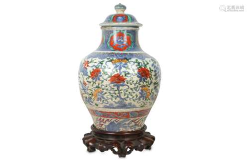 A CHINESE BLUE AND WHITE ENAMELLED VASE AND COVER.