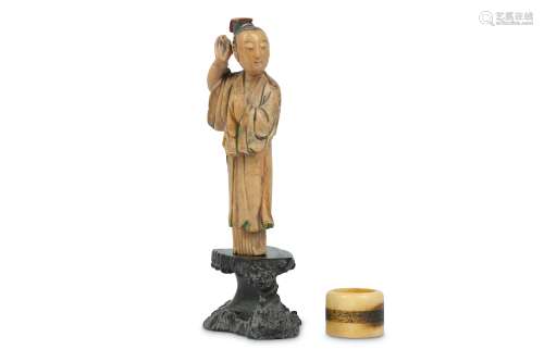 A SMALL CHINESE STAINED SOAPSTONE FIGURE TOGETHER WITH A DEER BONE ARCHER’S RING.
