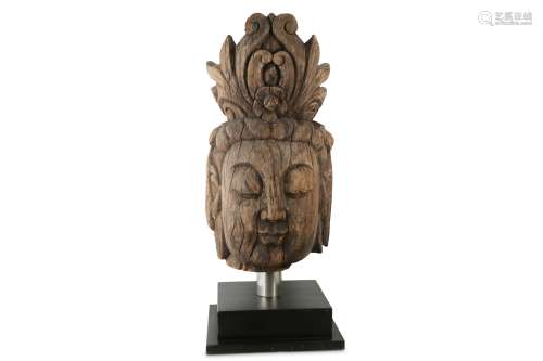 A LARGE WOOD HEAD OF A BUDDHA.