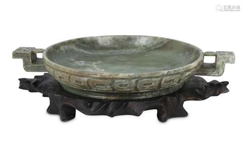 A CHINESE GREEN-GREY JADE OFFERING DISH.