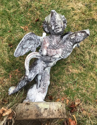 Antique Lead Cupid Holding Bird