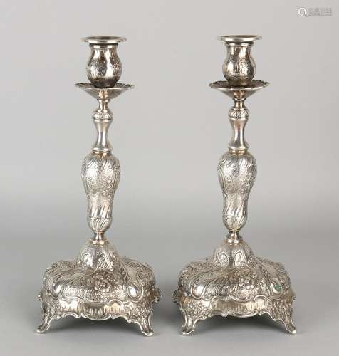 A set of silver candlesticks 800/000, rococo style.