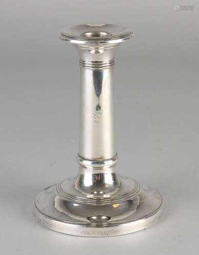 Silver candlestick, 925/000, on circular base. The