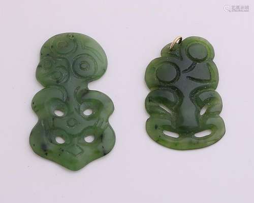 Two carved jade pendants, one with hanging eye. 24x46mm