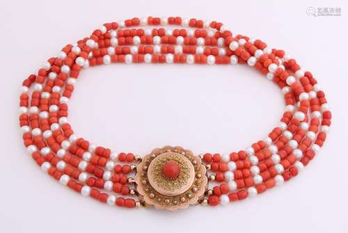 Necklace of coral beads and feature a yellow gold clasp