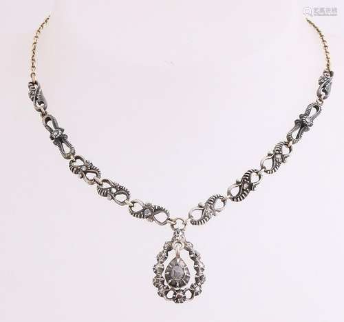 Ornate gold with silver choker with rose diamonds.