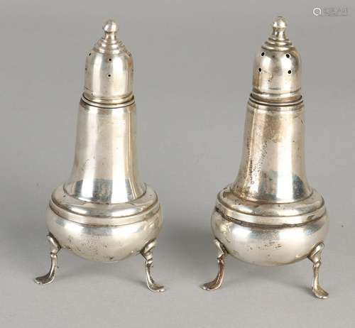 Two silver casters, 925/000, placed on three legs.