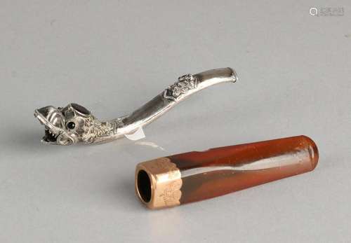 Two cigarette holders, a silver pipe, 925/000, with