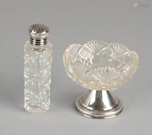 Two parts with silver, 835/000, a crystal bottle with