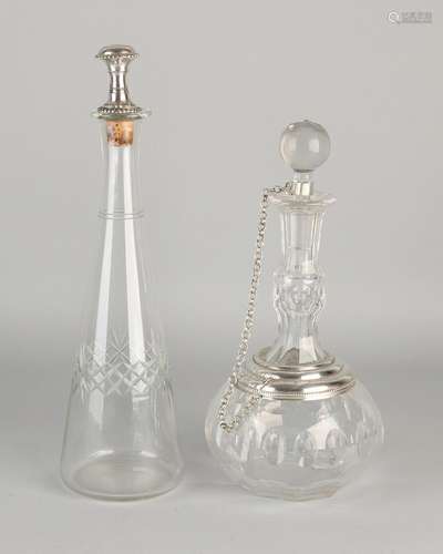 Two decanters with silver high carafe with cut edge