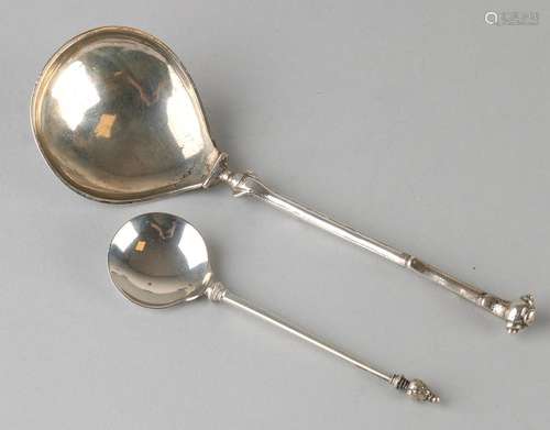 Two silver spoons, 833/000, one 18th century with round