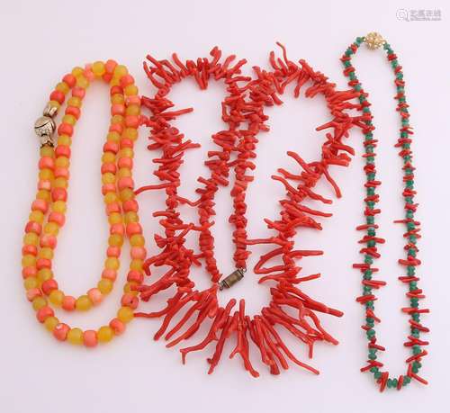 Three necklaces with gemstones. A necklace of coral