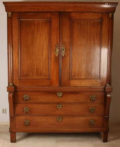 Dutch Empire oak cabinet with original gilt brass ring