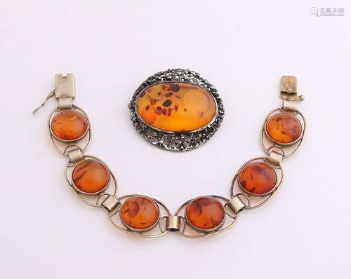 Silver brooch and bracelet with amber. Bracelet,