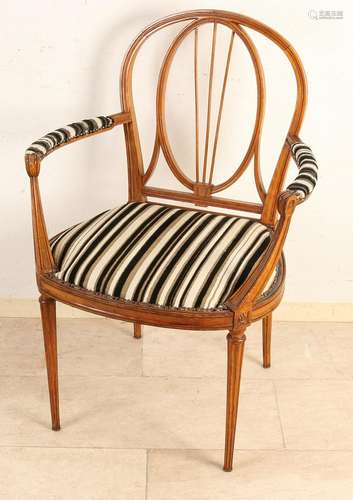 Antique walnut Louis XVI style armchair. Circa 1900.