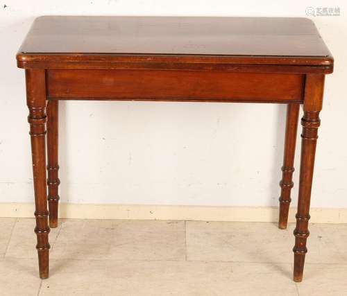 Antique English mahogany console with velvet on leaf.