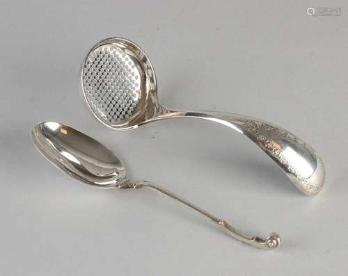 Silver dispensing spoon and cream spoon, 833/000, a