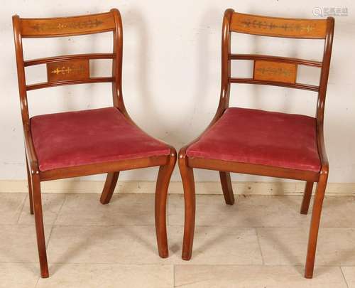 Four walnut chairs with brass intarsia. Approximately