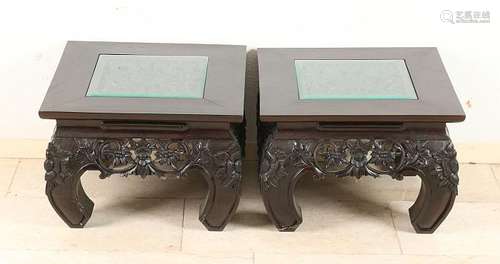 Two Oriental carved teak side tables. 20th century.