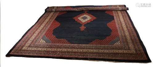 Persian rug in the colors dark blue / dark red with a