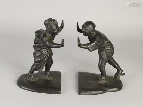 Two antique Japanese bronze bookends with signature.