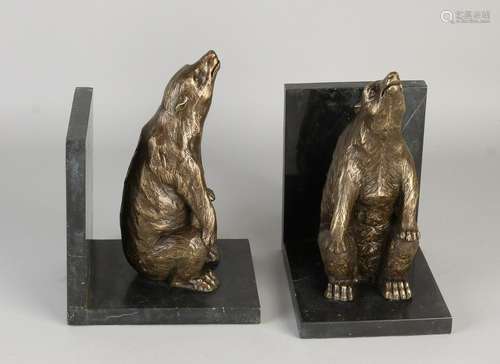 Two bronze bookends with black marble base. Incumbent