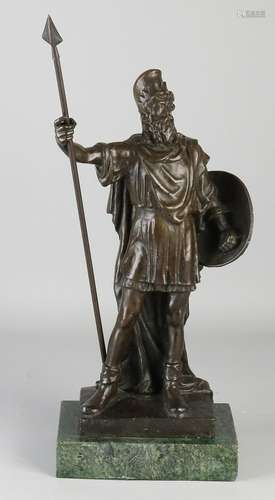 Old bronze figure on marble base. Warrior with spear.