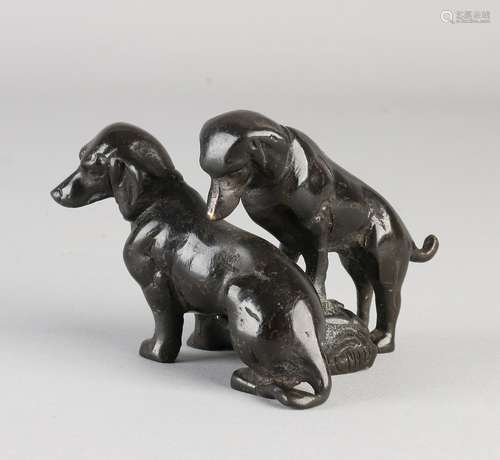 Antique bronze sculpture group. Two dachshunds in