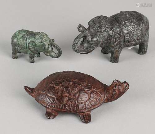 Three Oriental ancient bronze figures. Two elephants +