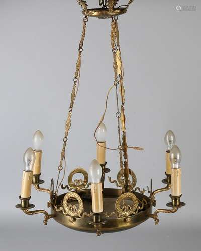 Brass Empire-style lamp. Two-colored patina. Circa