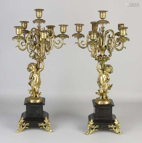 Two antique bronze six-light candle candlesticks with