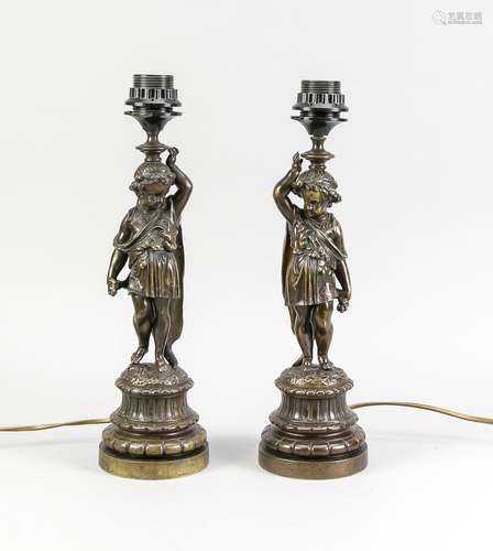 Two heavy antique bronze lamp bases with putti. Circa