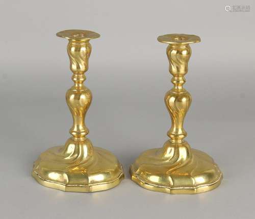 Two antique brass polished Baroque-style candle