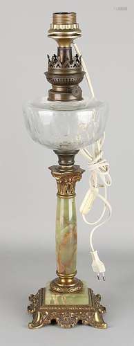 Antique standing petroleum lamp with brass capitel,