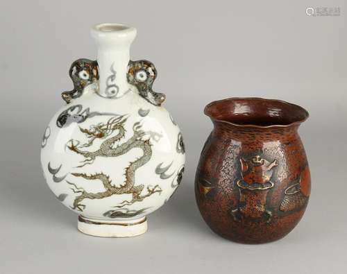 Twice China. One buyer driven vase with objects and