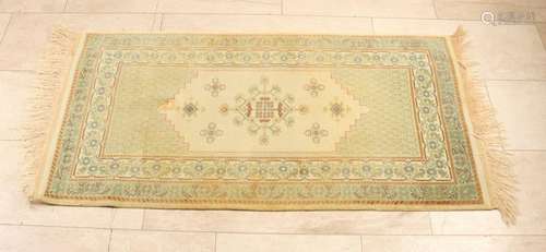 Persian rug. Cream-green. Size: 138 x 74 cm. In good