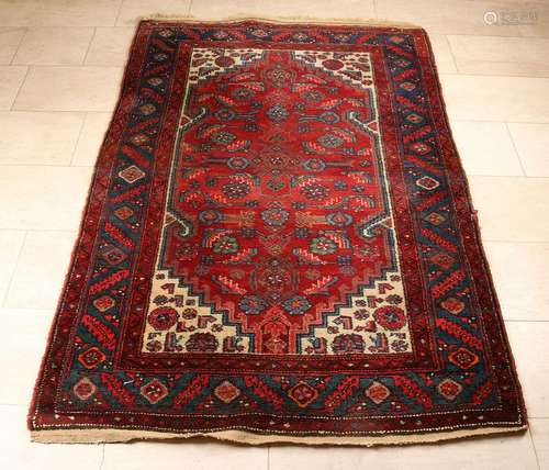 Persian rug. Multi-colored, red-blue-black et cetera.