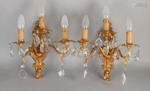 Two plated brass wall sconces with crystal icicles.