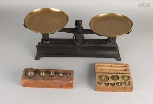 Antique weighing scales with two blocks. Circa 1900.