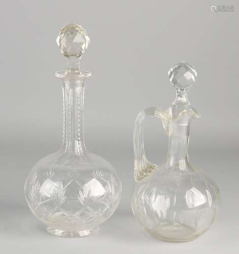 Two antique crystal decanters. One meal with almond