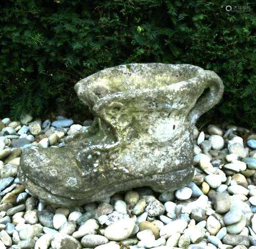 Large concrete poured vase in the shape of a shoe. 20th