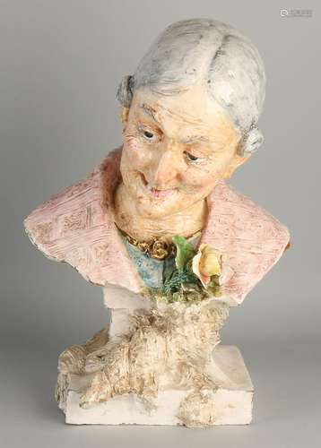 Antique ceramic bust of an old lady with rose. Circa