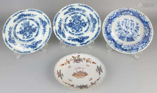 Set of four 18th century Delft plates with flower vase